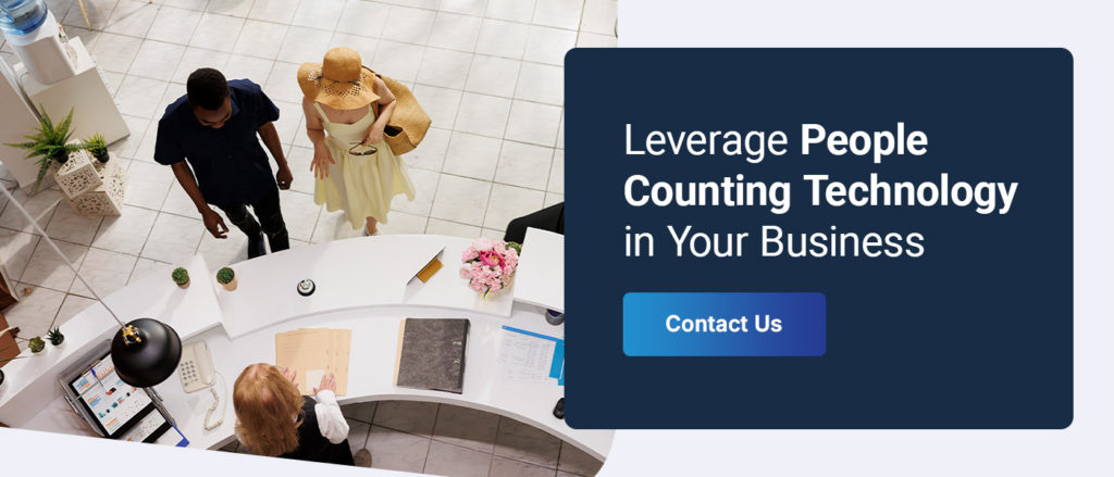 guests checking in at a business front desk