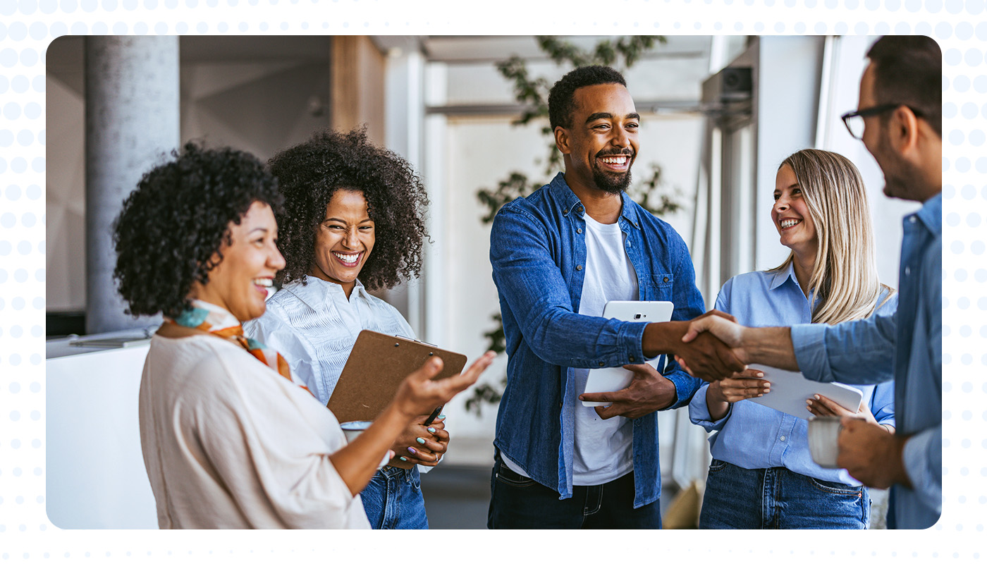 group of people shaking hands and conversing